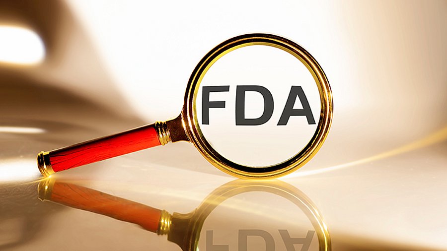 FDA concept. Magnifier glass with text on the white background in sunlight.
